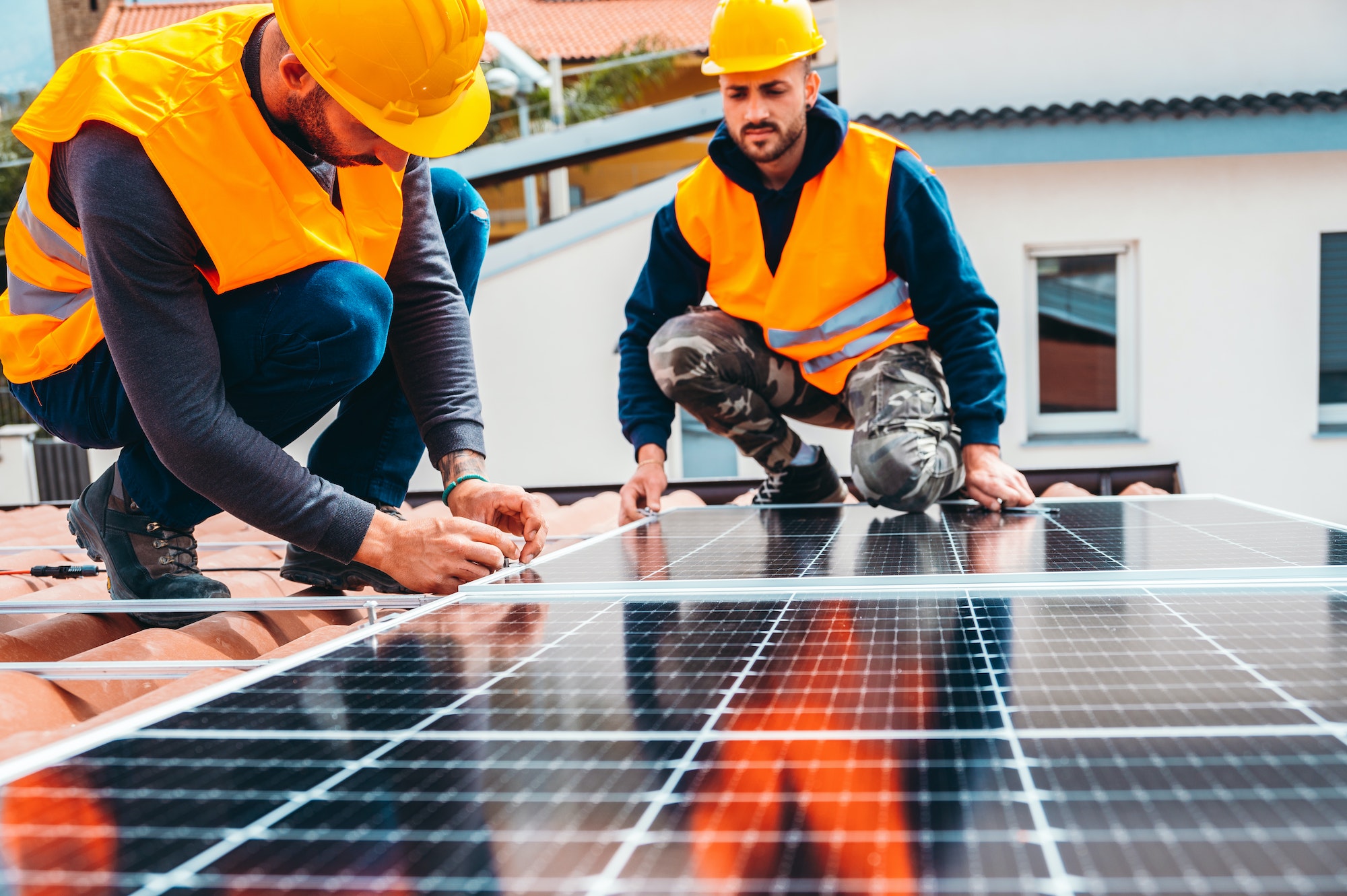 workers-assemble-energy-system-with-solar-panel-for-electricity.jpg